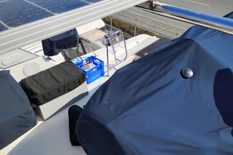 Slide: The Image of Bayliner 4788 Pilot House Motoryacht 2000 deck with covered equipment and storage crate. - 30