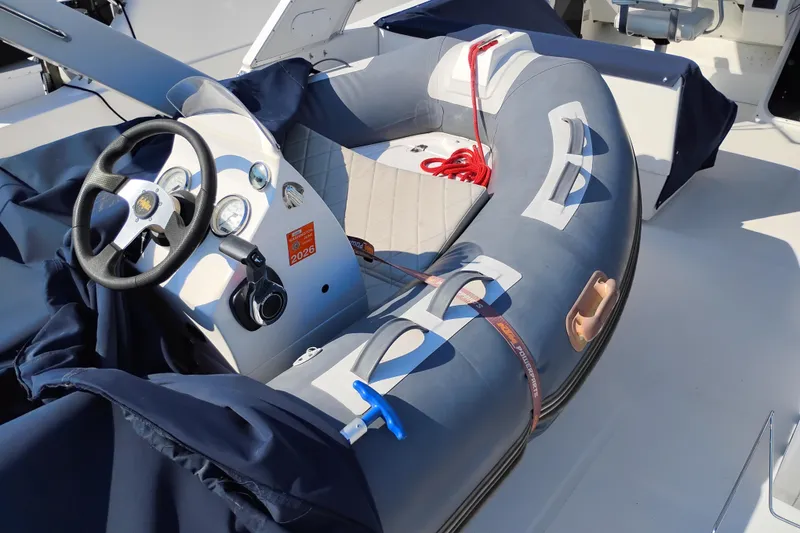 Slide: The Image of Steering console of a 2000 Bayliner 4788 Pilot House Motoryacht with inflatable boat. - 36
