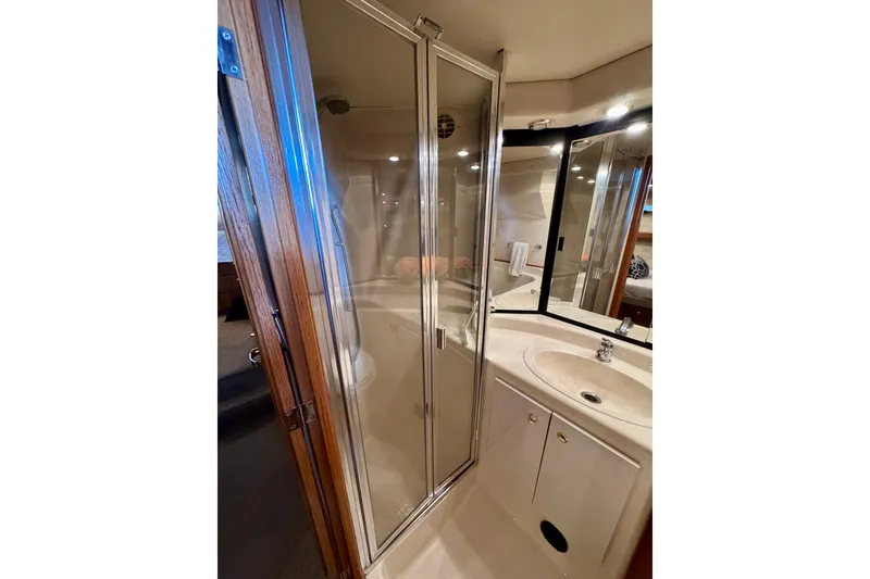Slide: The Image of Bathroom interior of 2000 Bayliner 4788 Pilot House Motoryacht with shower and sink. - 48