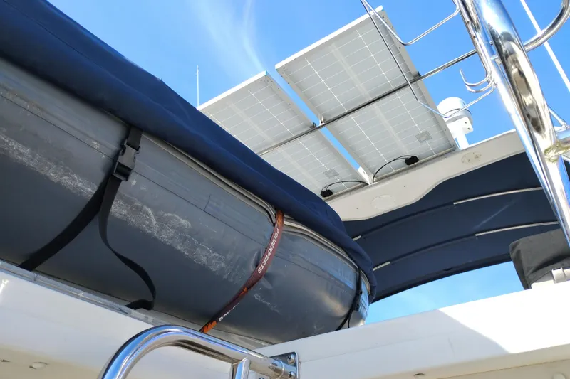 Slide: The Image of Bayliner 4788 Pilot House Motoryacht 2000 with solar panels and inflatable boat. - 5