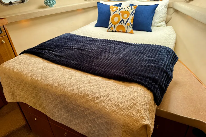 Slide: The Image of Cozy bedroom in 2000 Bayliner 4788 Pilot House Motoryacht with stylish bedding and pillows. - 55