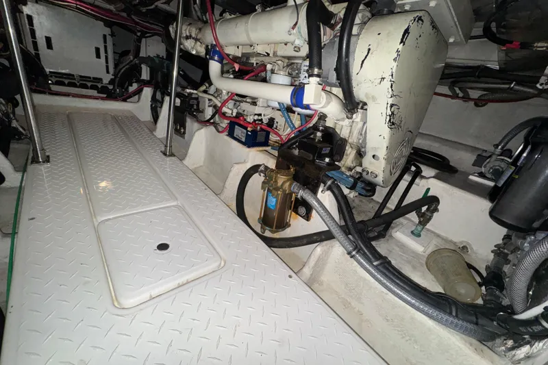 Slide: The Image of Engine room of 2000 Bayliner 4788 Pilot House Motoryacht with visible components and wiring. - 63