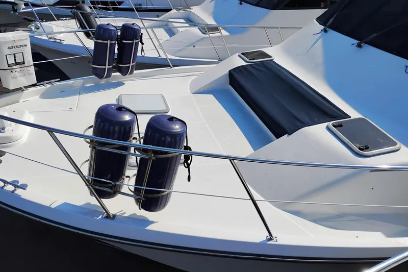 Slide: The Image of 2000 Bayliner 4788 Pilot House Motoryacht deck with fenders and safety equipment. - 65