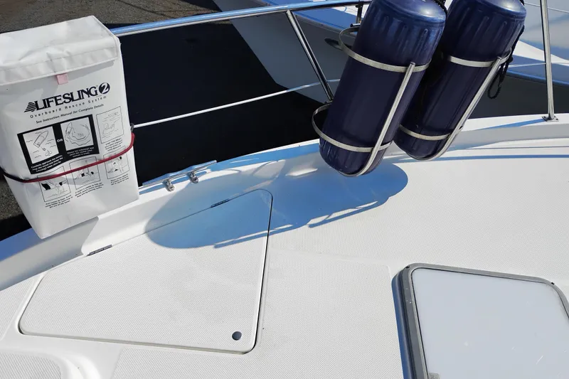 Slide: The Image of 2000 Bayliner 4788 Pilot House Motoryacht deck with lifesaving equipment and fenders. - 66