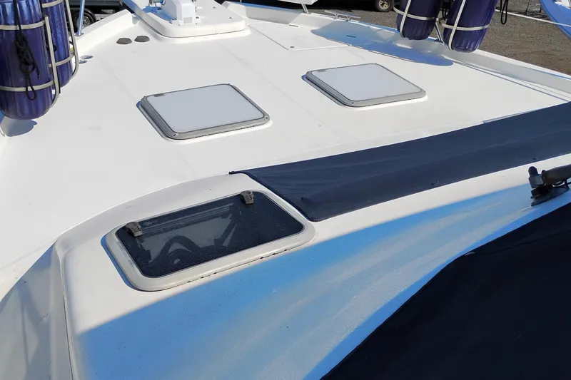 Slide: The Image of 2000 Bayliner 4788 Pilot House Motoryacht deck with hatches and fenders. - 67