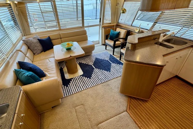 Slide: The Image of Luxurious interior of 2000 Bayliner 4788 Pilot House Motoryacht with modern furnishings. - 9