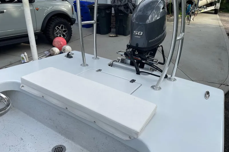 Slide: The Image of 2023 Riptide 17 Flats boat with Yamaha 50 engine, parked in driveway. - 13