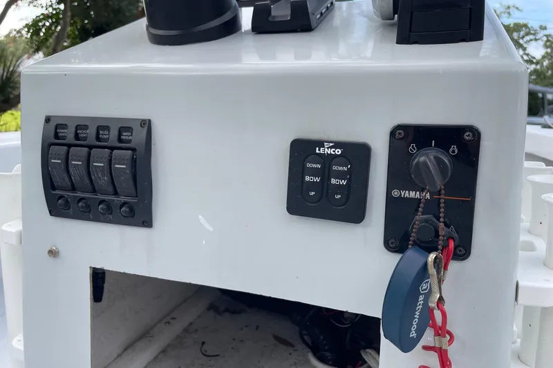 Slide: The Image of Control panel of 2023 Riptide 17 Flats boat with switches and Yamaha ignition. - 19
