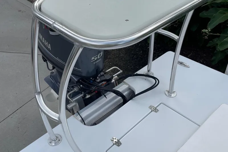 Slide: The Image of 2023 Riptide 17 Flats boat with Yamaha 50 engine, featuring sleek metal framework. - 21
