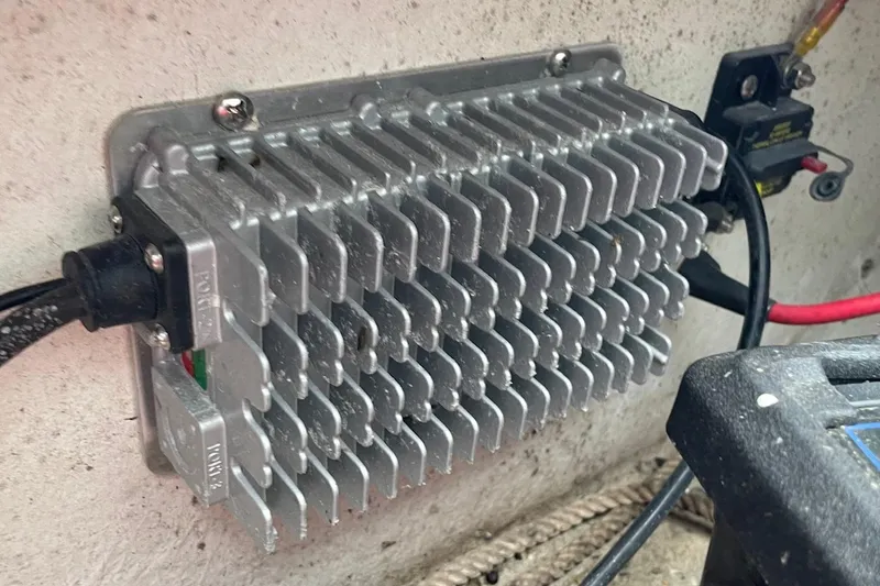 Slide: The Image of Aluminum heat sink on a 2023 Riptide 17 Flats boat, connected with cables. - 28