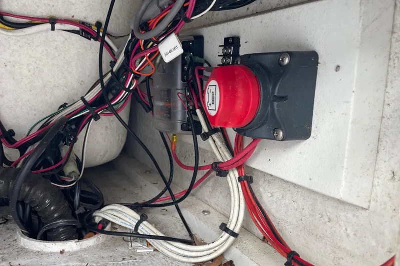 Slide: The Image of Electrical wiring and switch inside 2023 Riptide 17 Flats boat. - 29