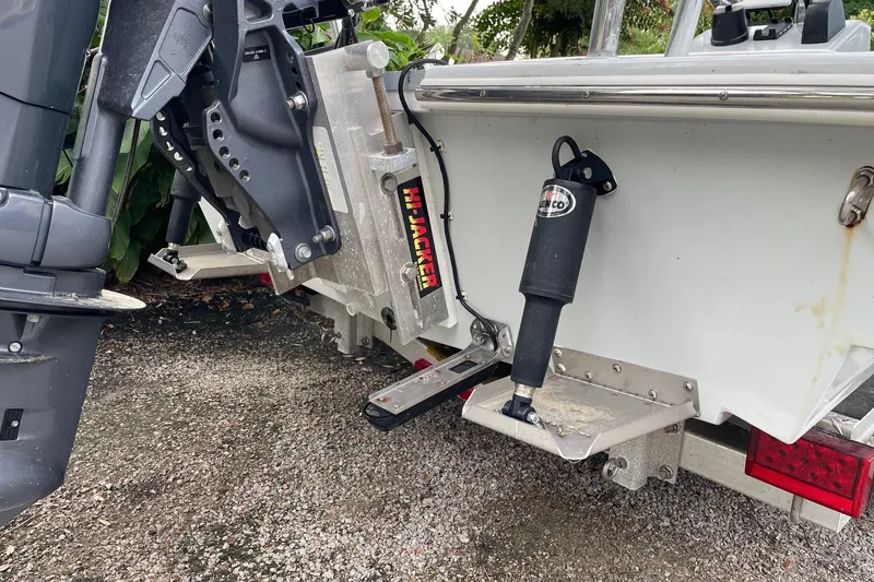 Slide: The Image of 2023 Riptide 17 Flats boat with outboard motor and hydraulic jack plate. - 31