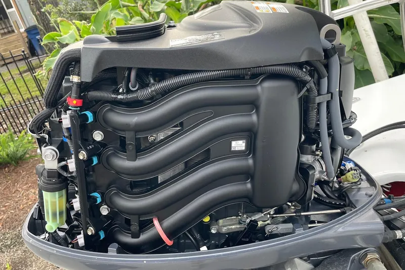 Slide: The Image of 2023 Riptide 17 Flats boat engine, detailed view of components and wiring. - 34