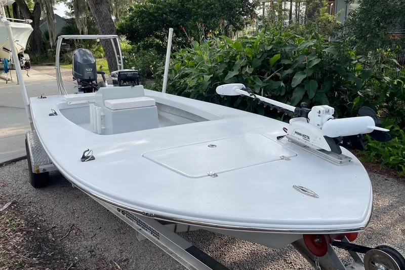 Slide: The Image of 2023 Riptide 17 Flats boat with Minn Kota trolling motor on trailer. - 9