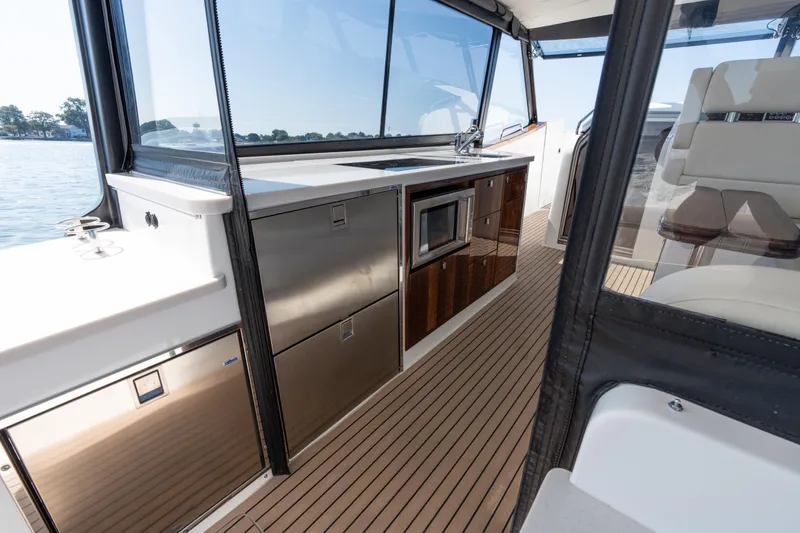 Slide: The Image of 2023 MJM Yachts 4 interior with elegant seating and scenic water view. - 20