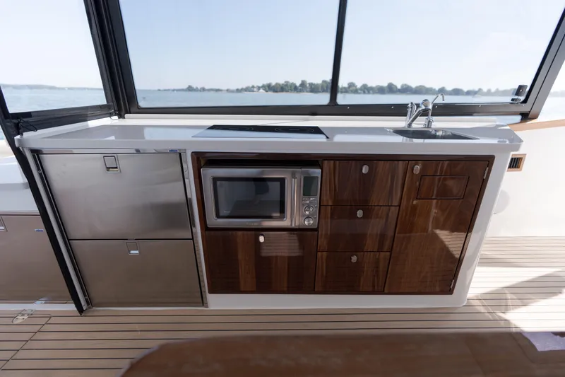 Slide: The Image of Luxurious seating on 2023 MJM Yachts 4 with built-in cup holders, ocean view. - 39