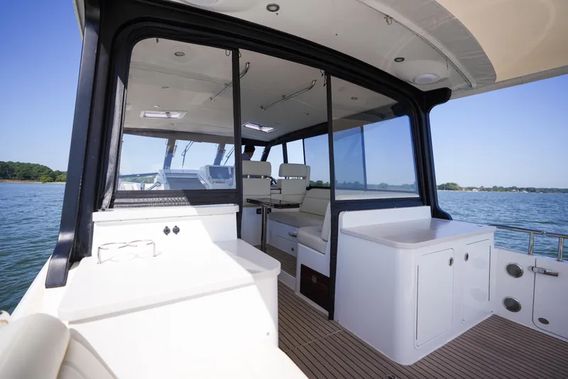 Slide: The Image of 2023 MJM Yachts 4 model, featuring spacious deck with seating and ocean view. - 45