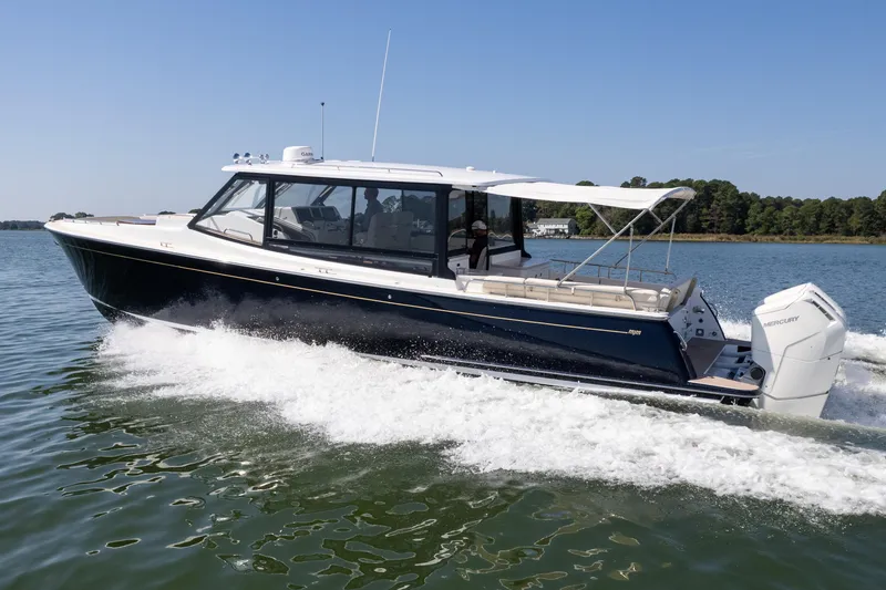 Slide: The Image of 2023 MJM Yachts 4 on calm water, showcasing sleek design and modern features. - 47