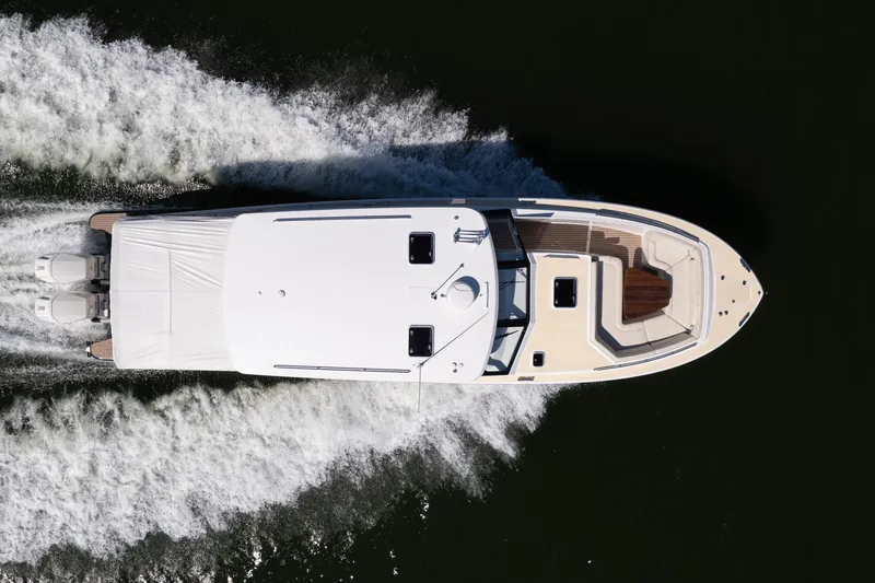 Slide: The Image of Aerial view of 2023 MJM Yachts 4 model cruising on water. - 49
