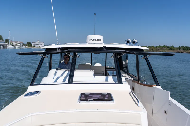 Slide: The Image of 2023 MJM Yachts 4 cruising on calm waters under clear blue skies. - 54