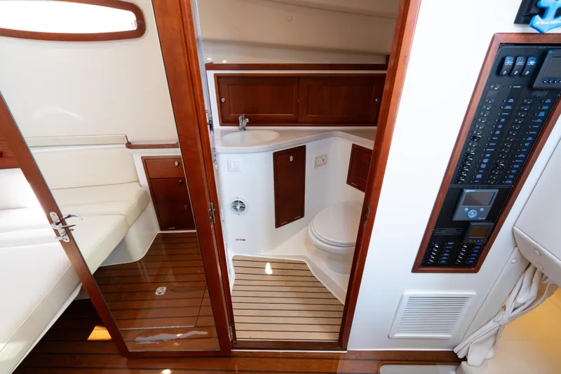 Slide: The Image of 2023 MJM Yachts 4 interior with wooden finishes and modern amenities. - 55