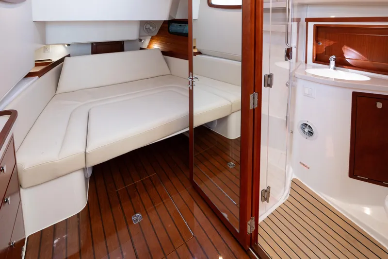 Slide: The Image of Luxurious interior of 2023 MJM Yachts 4, featuring elegant wood finishes and comfortable seating. - 61