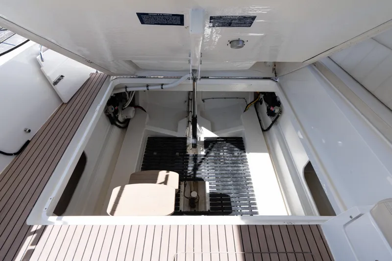 Slide: The Image of 2023 MJM 4 boat engine compartment with open hatch, showcasing interior details. - 63