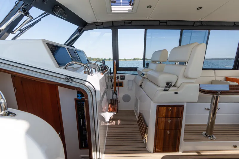 Slide: The Image of 2023 MJM Yachts 4 interior with sleek design and spacious deck on calm waters. - 8