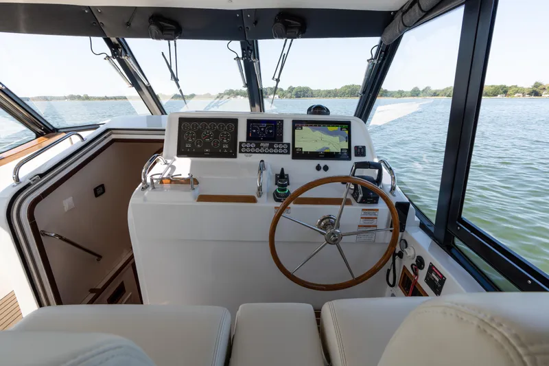 Slide: The Image of 2023 MJM Yachts 4 cruising on water with dual 500 V12 engines. - 9