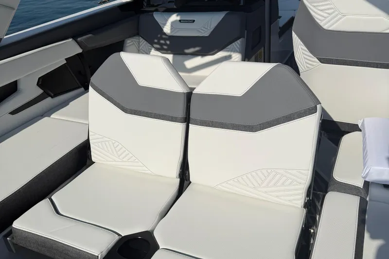 Slide: The Image of 2026 MasterCraft XStar 23 boat interior with modern white and gray seating design. - 10