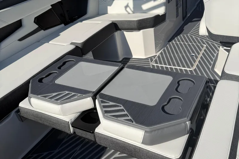Slide: The Image of 2026 MasterCraft XStar 23 interior with sleek seating and integrated cup holders. - 11