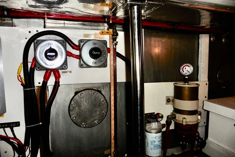 Slide: The Image of Engine room of 2000 Ocean Alexander 423 Classico with switches and gauges. - 100