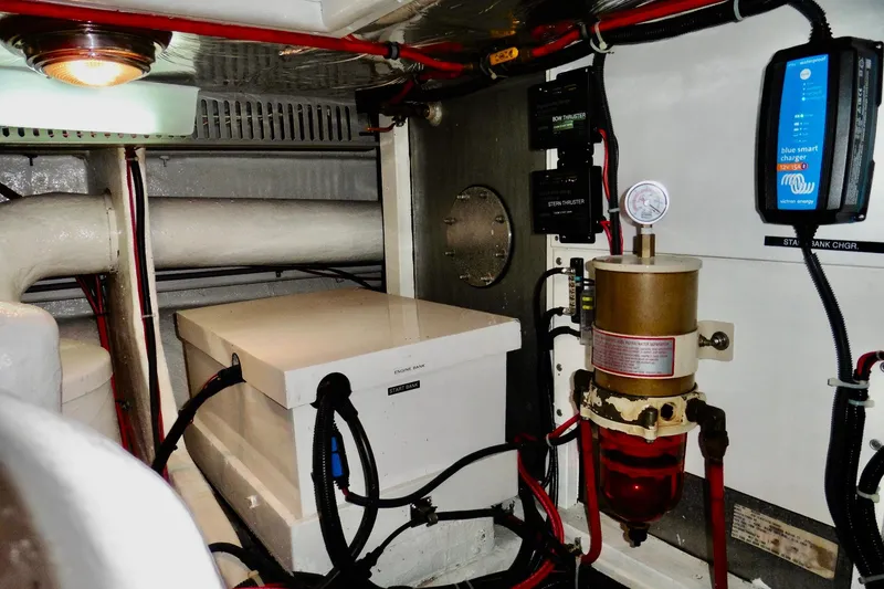 Slide: The Image of Engine room of 2000 Ocean Alexander 423 Classico with electrical components and fuel filter system. - 102
