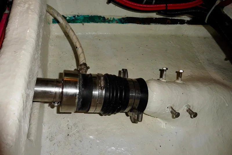 Slide: The Image of Ocean Alexander 423 Classico 2000 boat shaft seal and hose clamps in engine room. - 103