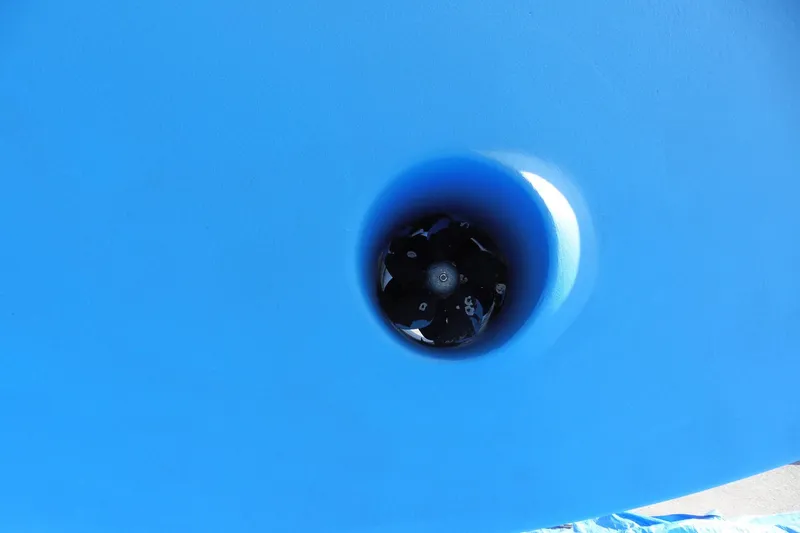 Slide: The Image of Close-up of Ocean Alexander 426 Classico Sedan 1997 boat thruster in blue hull. - 107