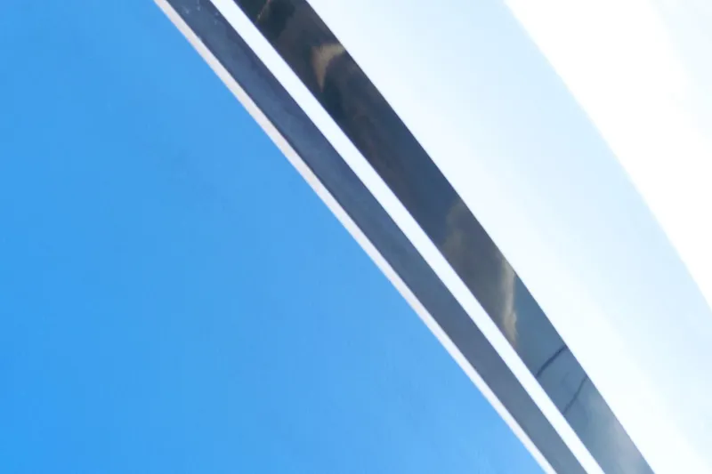 Slide: The Image of Close-up of Ocean Alexander 426 Classico Sedan yacht, 1997, featuring sleek blue and white design. - 108