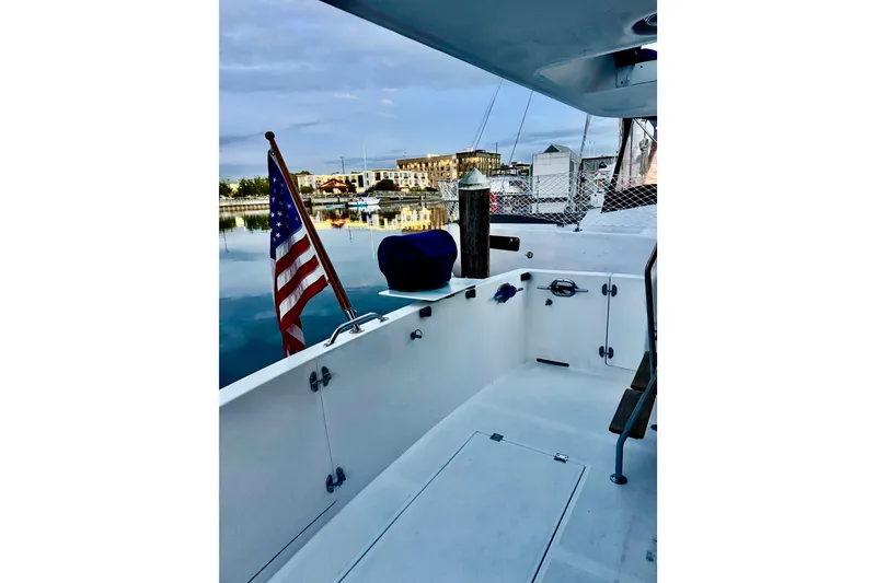 Slide: The Image of Bow deck of 2000 Ocean Alexander 423 Classico yacht with anchor and winch. - 11