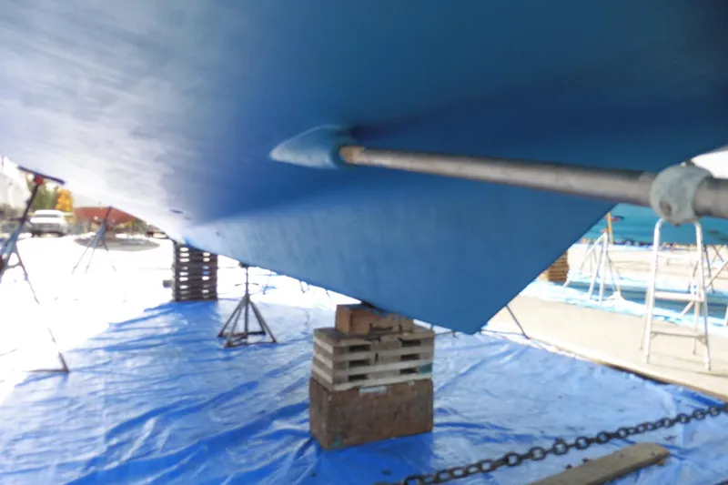 Slide: The Image of Bottom view of 1997 Ocean Alexander 426 Classico Sedan on dry dock, supported by blocks. - 110