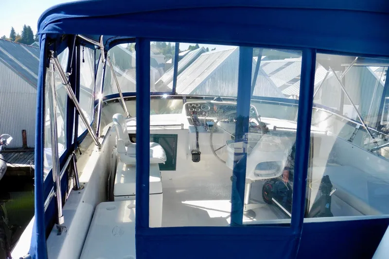 Slide: The Image of 2000 Ocean Alexander 423 Classico yacht docked near boathouses, view from cockpit. - 20