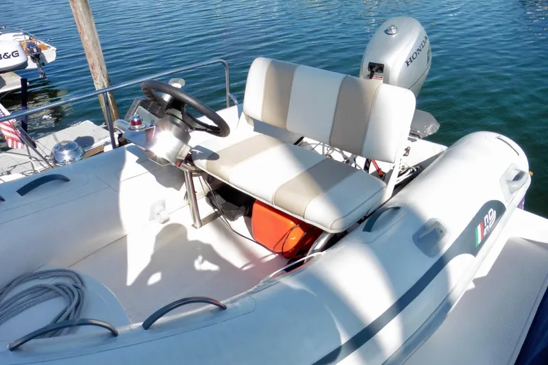 Slide: The Image of Covered Ocean Alexander 423 Classico yacht, 2000 model, docked at a marina. - 24