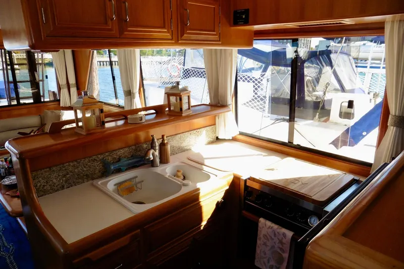 Slide: The Image of Luxurious interior of 2000 Ocean Alexander 423 Classico yacht with cozy seating and TV. - 35