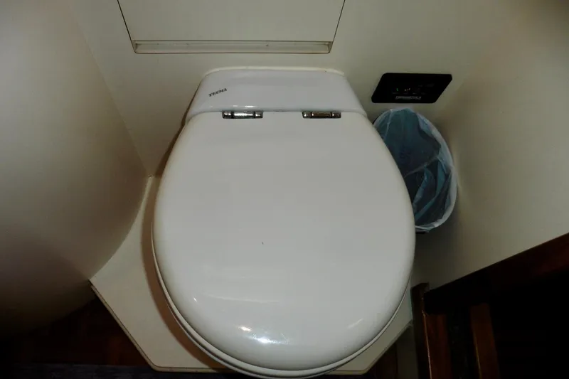 Slide: The Image of Engine hour meter and voltmeter on 2000 Ocean Alexander 423 Classico dashboard. - 58