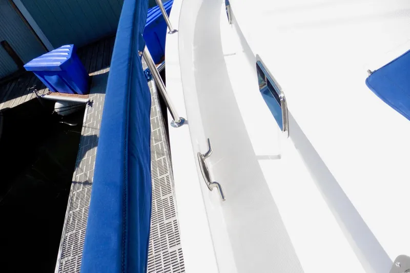 Slide: The Image of 1997 Ocean Alexander 426 Classico yacht deck with sleek design and modern features. - 8