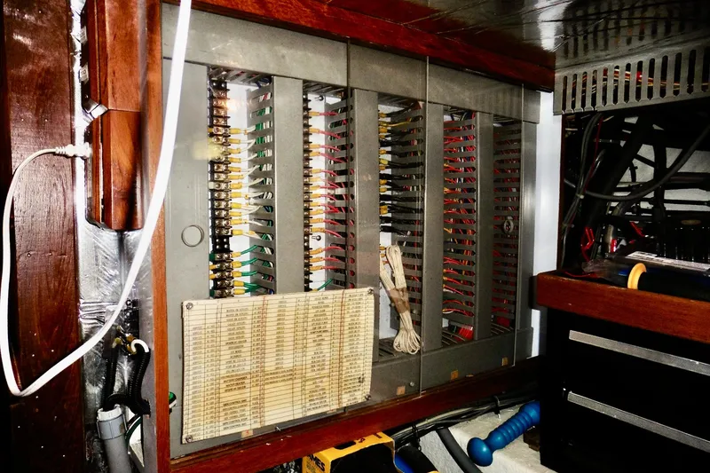 Slide: The Image of Electrical panel inside 2000 Ocean Alexander 423 Classico yacht, showcasing wiring and components. - 94