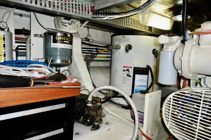 Slide: The Image of Engine room of 2000 Ocean Alexander 423 Classico with marine equipment and wiring. - 95