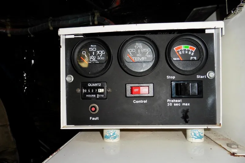 Slide: The Image of Control panel of a 2000 Ocean Alexander 423 Classico boat, displaying gauges and switches. - 97