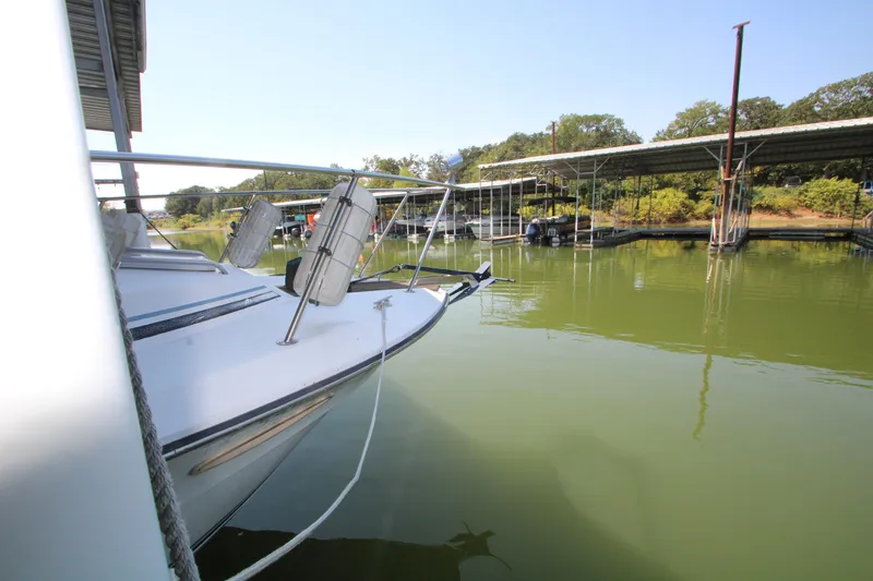 Slide: The Image of Dashboard gauges of a 1986 Sea Ray 340 Sundancer boat, displaying various engine metrics. - 37