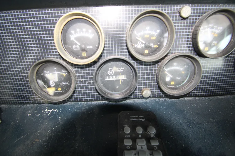 Slide: The Image of Dashboard gauges of a 1986 Sea Ray 340 Sundancer boat. - 38