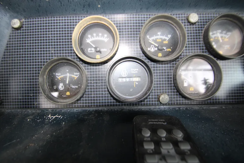 Slide: The Image of Engine compartment of 1986 Sea Ray 340 Sundancer with visible components and wiring. - 39