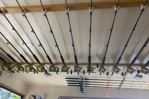 Slide: The Image of Fishing rods neatly stored on a 1989 Breaux Brothers 42 Sportfisherman boat ceiling. - 11